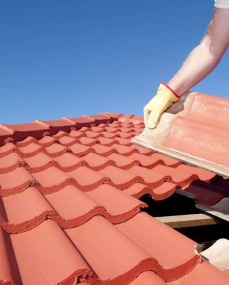 Construction worker tile roofing repair- Big Easy Roofing