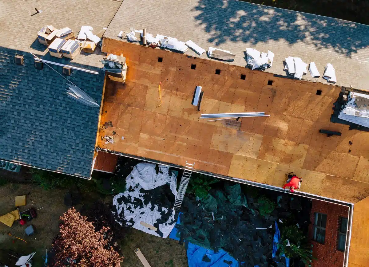 Homeowner reviewing roof insurance claim documents in Louisiana